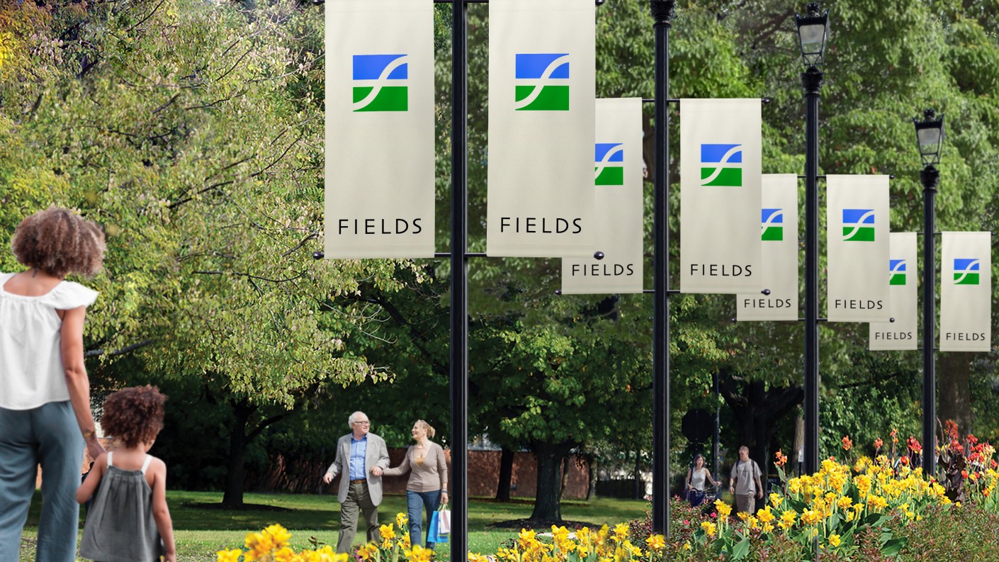 Fields菲爾茲莊園社區(qū)住宅地產(chǎn)logo設(shè)計，彎曲“F”表示河流和干道的交叉